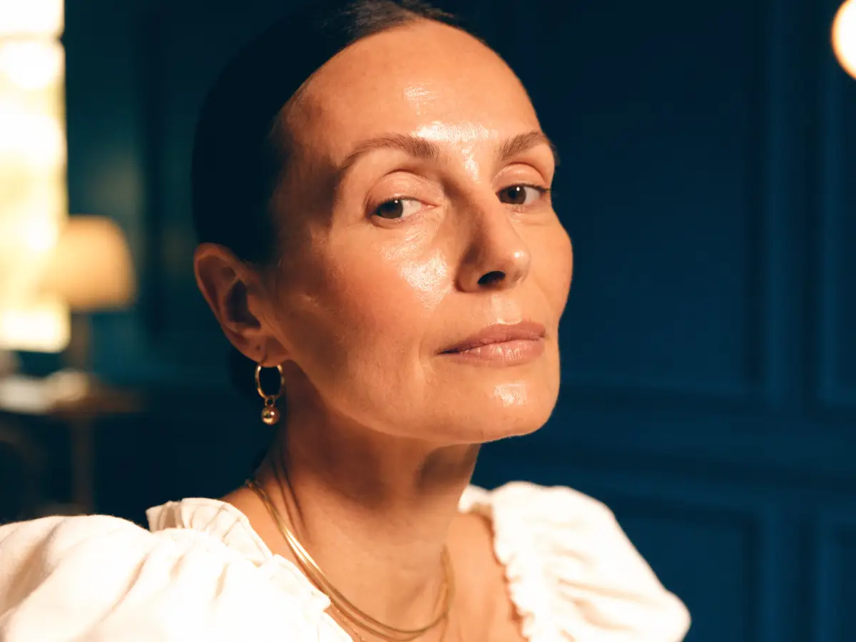 A woman with clear, even-toned skin after pigment-correction care at Pura Vida in Fleming Island, FL