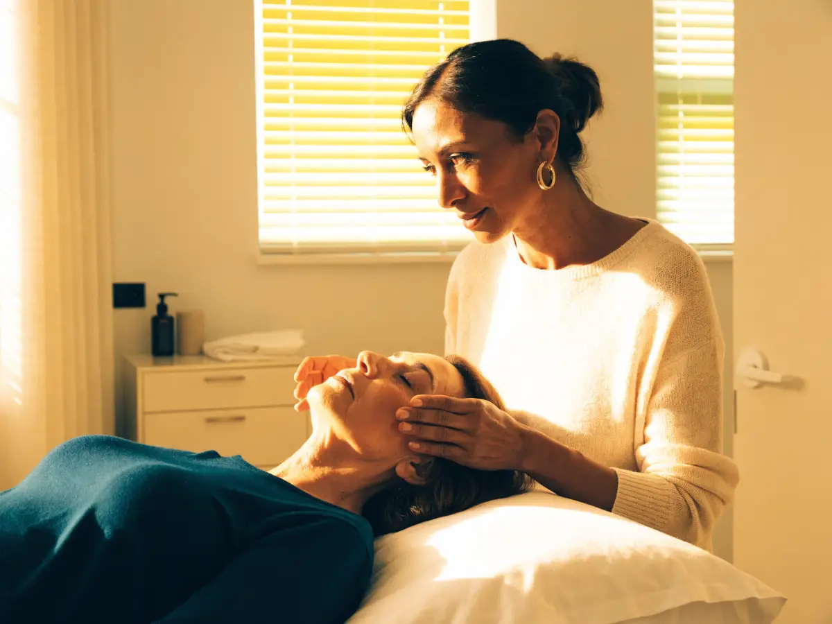 A medical aesthetician consulting with a guest about their skin before a facial at Pura Vida in Fleming Island, FL
