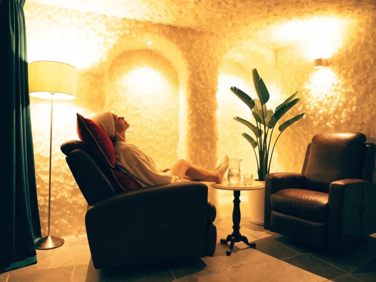 The Himalayan Salt Cave at the Pura Vida Day Spa in Fleming Island, FL, with zero-gravity recliners inside a room lined in mineral salt