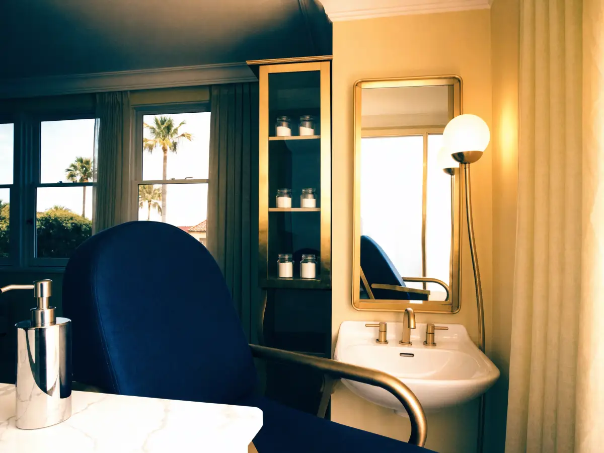 A Medical Aesthetician preparing a warm wax treatment in a calm treatment room at the Pura Vida Day Spa in Fleming Island, FL